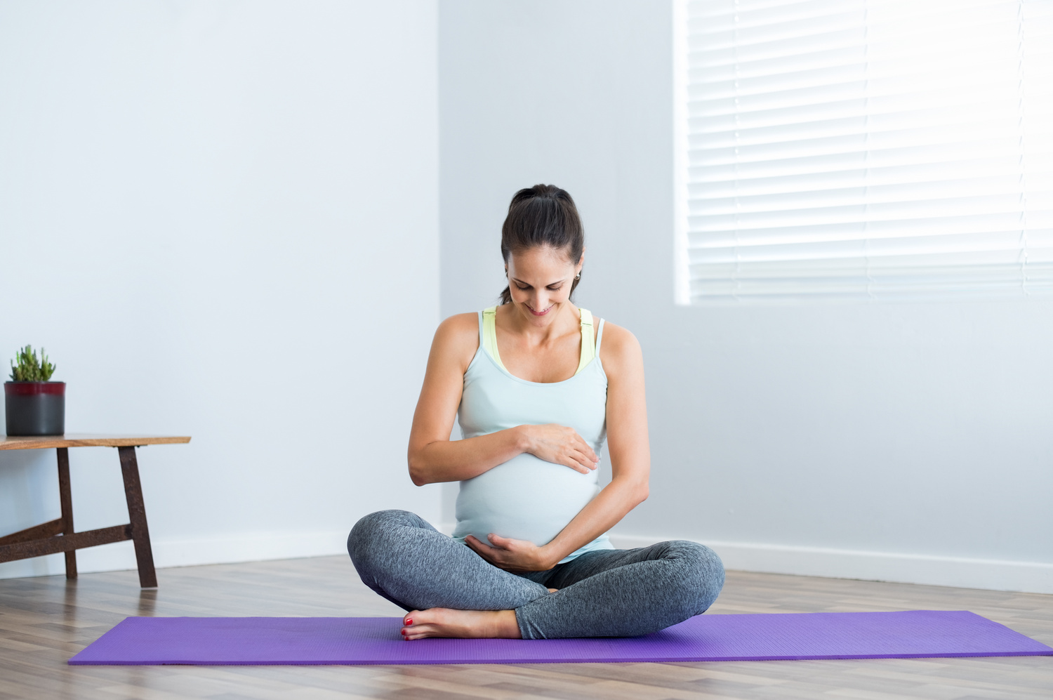 Pregnancy Yoga Exercise on a Yoga Mat